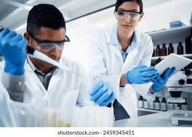 People, teamwork or scientists on tablet for test tube results, life extension or antiaging medicine in laboratory. Assistant, vial or biologists with chemistry research, liquid or science update - Powered by Shutterstock