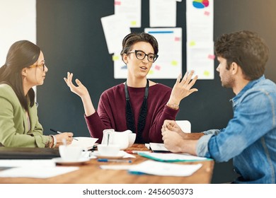 People, teamwork or writers talking in startup meeting for writing solution, conversation or discussion. Paperwork, woman and editors in office for planning, creative ideas or group collaboration - Powered by Shutterstock