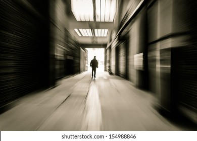 People Through Doorway At A Factory Building,motion Blur