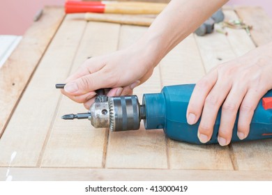 People Tighten Or Loose Screw Of The Electric Drill