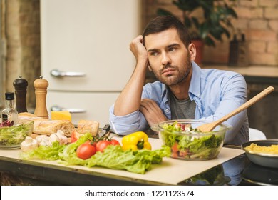 People, Tiredness And Overwork Concept. Sad Unhappy Tired Man Coocking In The Kitchen. Chef In Stress. 