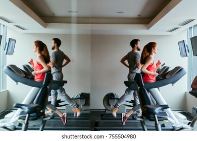 People Traning In Gym On Various Machines