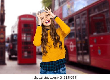 People, Travel, Tourism And Fashion Concept - Happy Young Woman Or Teen Girl In Casual Clothes And Hipster Hat Having Fun Over London City Street Background