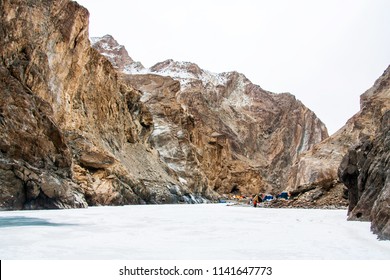 People trekking on frozen zanskar river. Camping tents setup on river bank.
Chadar trek. Leh Ladakh. India - Powered by Shutterstock