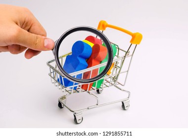 People In A Trolley For A Supermarket. Concept Of Human Trafficking, Modern Slavery. Buying People Is A Violation Of International Laws. Freedom And Deprivation Of Human Rights