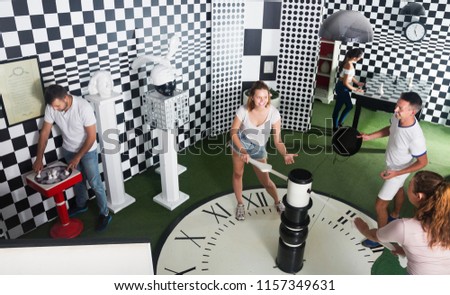 People trying to find solution of conundrum in closed space of lost room