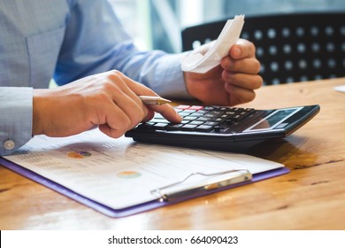 People Use A Calculator And Calculate Office Expenses