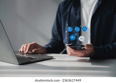 People using social media and digital online marketing concepts on mobile phones with icons such as notifications, messages, comments on the smartphone screen. - Shutterstock ID 2363617449