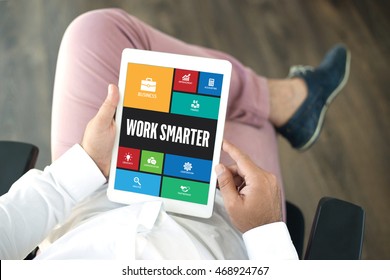 People using tablet pc in office and WORK SMARTER icons concept on screen