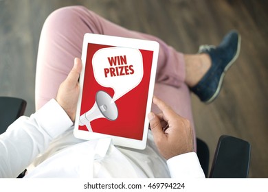 People using tablet pc and WIN PRIZES announcement concept on screen