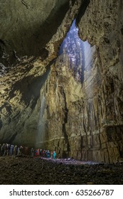 People Viewing The Underground Area In Gaping Gill