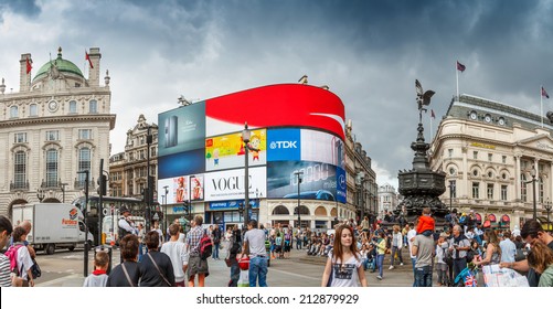 People visit Piccadilly Circus on August 13, 2014 in London. 