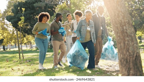 People, volunteer and smile for pick up dirt at park with plastic bag for cleaning, earth day and community service. Outdoor, litter and waste collection for maintenance, environment and charity work - Powered by Shutterstock