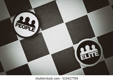 People vs Elite - Draughts (Checkers) - Break up of society and tension between classes. Privileged, well-educated, rich class vs working class (vignetting, dramatic exposure, muted blacks) - Shutterstock ID 515417704