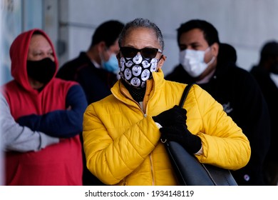 People Wait In Line To Receive The New One-shot Johnson And Johnson COVID-19 Vaccine At A Vaccination Event At Baldwin Hills Crenshaw Plaza In Los Angeles On March 11, 2021. 