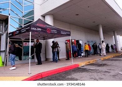 People Wait In Line To Receive The New One-shot Johnson And Johnson COVID-19 Vaccine At A Vaccination Event At Baldwin Hills Crenshaw Plaza In Los Angeles On March 11, 2021. 