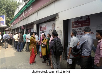 People Wait In Long Queue At Bank To Deposit Old Denomination Currency Notes After The Central Government Demonetized The Indian Currency Of Rs. 500 & Rs. 1000 On November 10, 2016 In Calcutta, India.