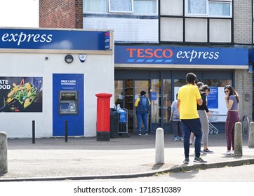 People Waiting To Get In Tesco Express Slough England 29.04.2020