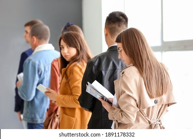 People Waiting In Line At The Airport