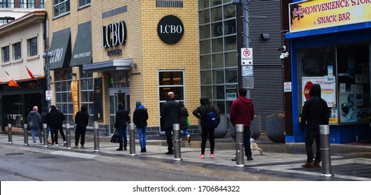 People Waiting In The Line Outside LCBO, Liquor Control Board Of Ontario,  Lequqir Store In Kitchener, Ontario, Canada In April 17, 2020