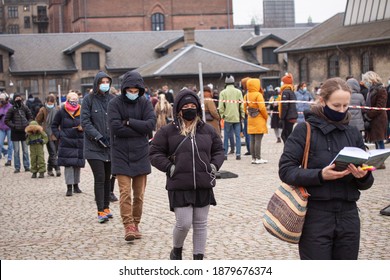 People Waiting In Line Queued Up For Health Screening For Coronavirus Covid-19 Testing Or Vaccine At City Test Center. Copenhagen, Denmark - December 21, 2020.