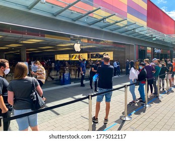 People Waiting In Long Queue At Apple Store. Germany, Frankfurt - JULI 11 2020 