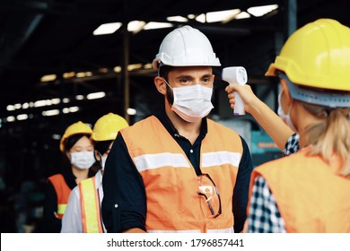 People waiting for scanning the temperature of body before working. Worker people group scan temperature of body at outside factory. - Shutterstock ID 1796857441