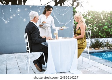 People, waitress and happy with food for couple outdoor for catering, hospitality or romantic dinner. Love, relationship and meal for fine dining or date with happiness and service at restaurant - Powered by Shutterstock