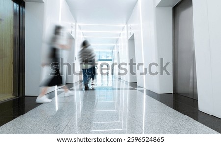 People walk in the elevator corridor