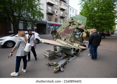 People Walk Next To A Fragment Of A Russian Military Aircraft During An Exhibition Displaying Destroyed Russian Military Equipment Amid Russian Invasion Of Ukraine In Kyiv, Ukraine. May 8, 2022.