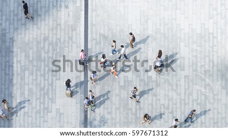 people walk on across the pedestrian concrete pavement (wide angle of aerial top view)