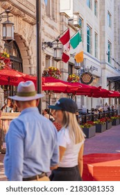 People Walk On The Street Of Victoria BC. An Irish Pub In Bastion Square, A Pedestrian Area In Victoria British Columbia Canada. Travel Photo, Blurred People-July 19,2022