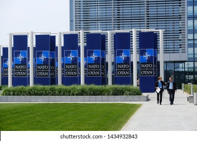 People Walk Outside Of  The NATO Headquarters In Brussels, Belgium, June 26, 2019.