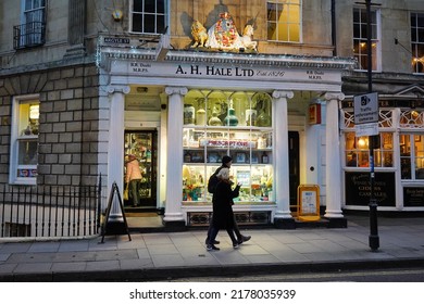 People Walk Past A Pharmacy On A Street In The City Centre On December 31, 2018 In Bath, UK.