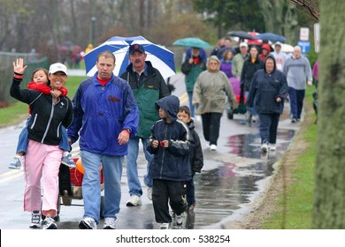 People Walk In The Rain For A Fund-raising Walkathon For Multiple Sclerosis. Editorial Use Only.