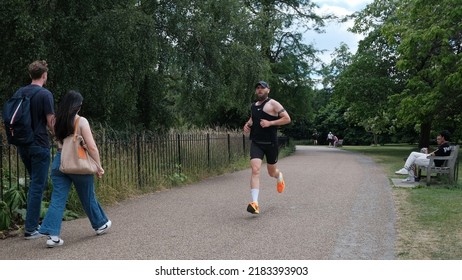 People Walk And Run Through A City Centre Park On July 7, 2022 In London, UK.
