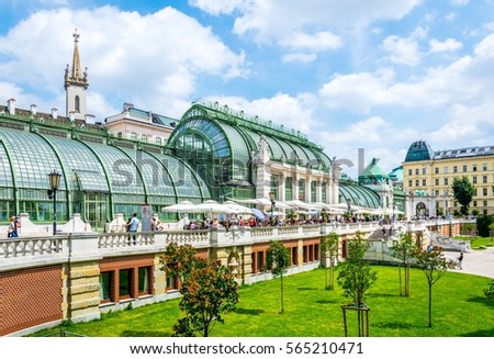 people are walking around the famous palmenhaus cafe situated next to the hofburg palace in Vienna, Austria