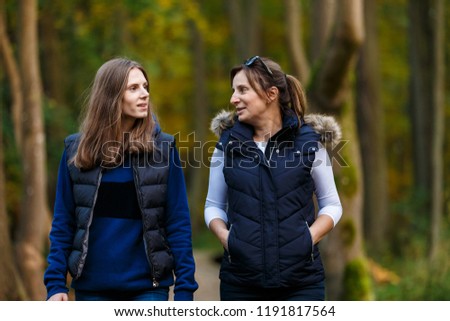 Similar – happy twin sisters stand on a bridge and look up