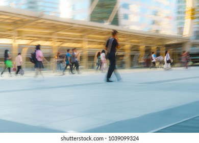 People walking in motion blur in the city