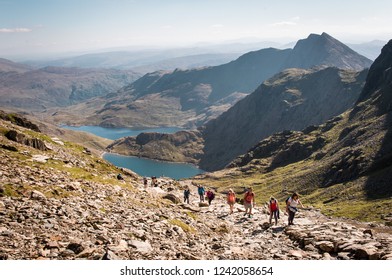 People Walking Up Mount Snowdon In Wales