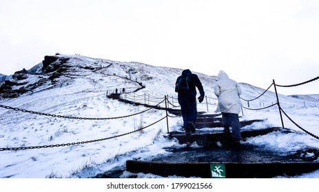 People Walking Up Mountain Stairs