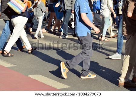 People walking on big city street, blurred motion crossing abstract