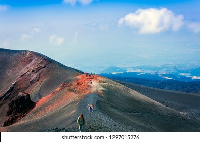 People Walking On Mount Etna, Active Volcano On The East Coast Of Sicily, Italy