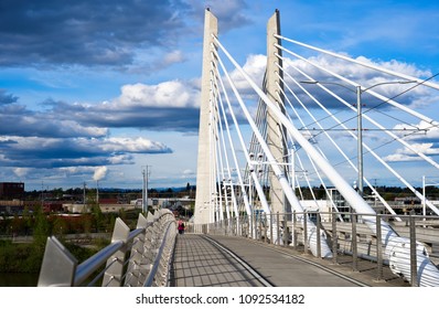 People Walking On Pedestrian And Bicycle Path Next To The Streetcar  And Bus Roadway Through The Rope Tilikum Crossing Bridge Across The Willamette River In Down Town Portland Oregon