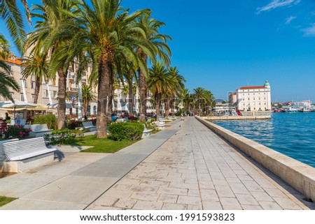 People are walking on seaside promenade in Split, Croatia