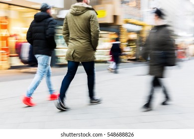 People Walking On A Shopping Street With Camera Made Motion Blur