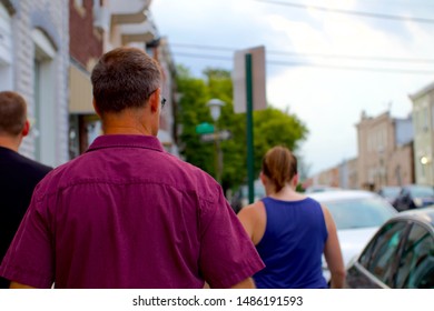 People Walking On Sidewalk In Baltimore