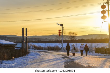 People Walking At Snow Village In Mohe County, China.