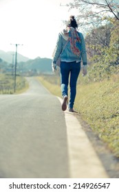 People Walking A Straight Line On The Road