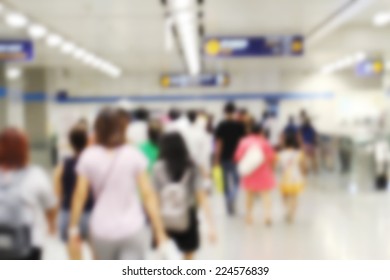 People are walking in the subway station. Blur background.